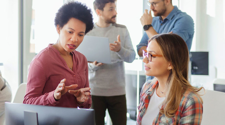 People working in the office together